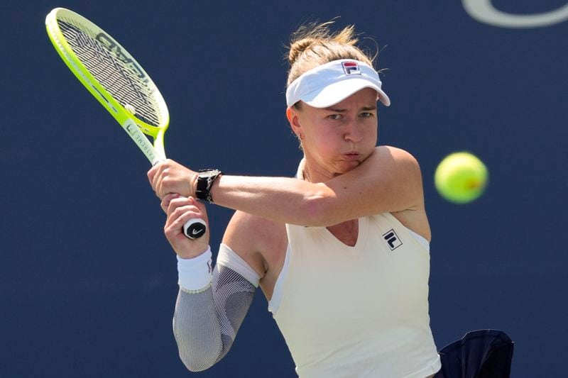 Barbora Krejcikova, of the Czech Republic, returns a shot to Elena-Gariela Ruse, of Romania, returns a shot to Barbora Krejcikova, of the Czech Republic, during the first round of the U.S. Open tennis championships, Wednesday, Aug. 28, 2024, in New York. (AP Photo/Kirsty Wigglesworth)