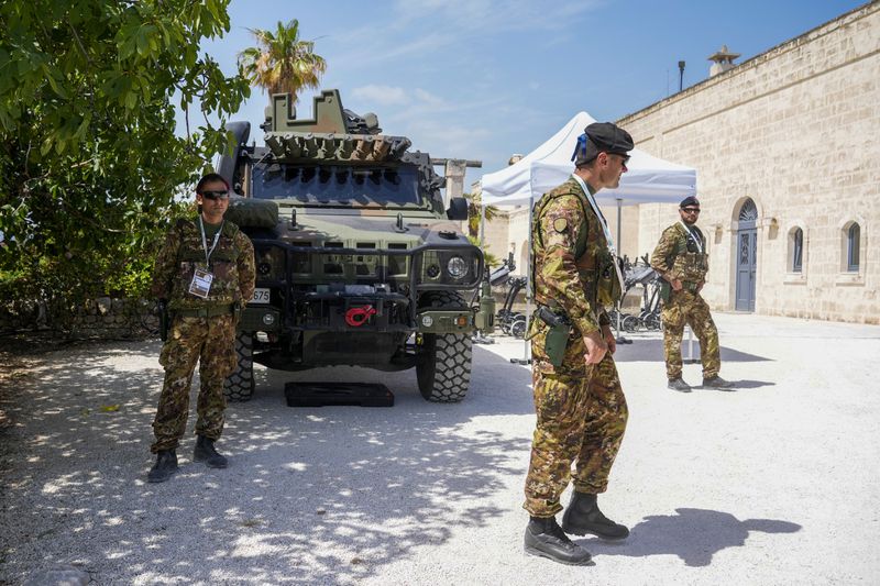 Italian security force members take positions during a G7 summit at Borgo Egnazia, Italy, Thursday, June 13, 2024. (AP Photo/Andrew Medichini)