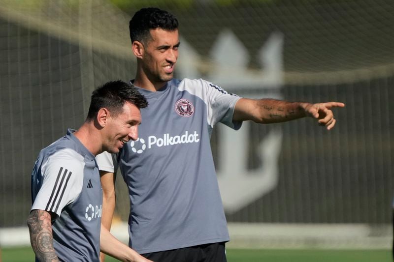 Inter Miami forward Lionel Messi, foreground, and midfielder Sergio Busquets chat as they work out at the MLS soccer team's training facility, Friday, Sept. 13, 2024, in Fort Lauderdale, Fla. (AP Photo/Wilfredo Lee)