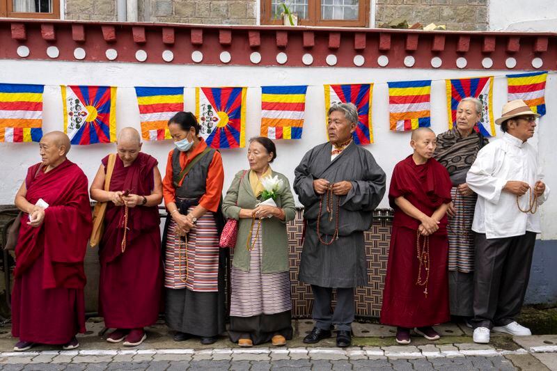 Exiled Tibetans wait to welcome their spiritual leader the Dalai Lama before he arrived in Dharamshala, India, Wednesday, Aug. 28, 2024. (AP Photo/Ashwini Bhatia)