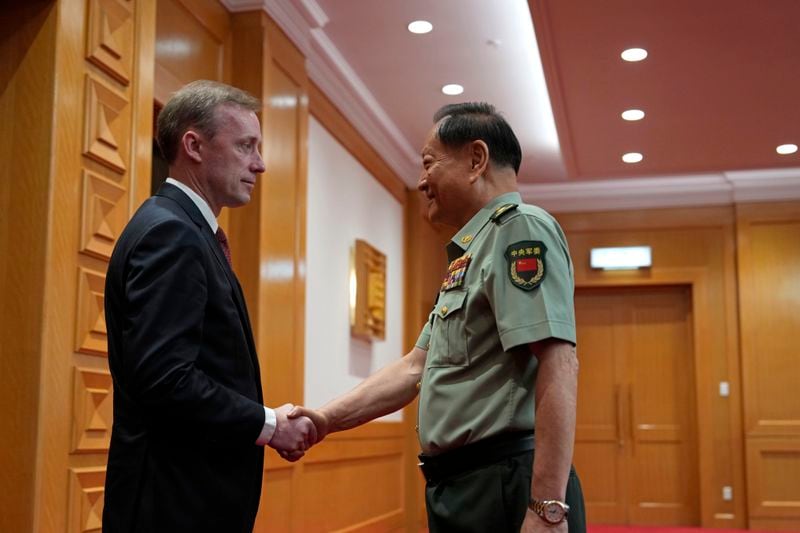 Zhang Youxia, vice chairman of the CPC Central Military Commission, right, shakes hands with White House national security adviser Jake Sullivan before a meeting at the Bayi building in Beijing, Thursday, Aug. 29, 2024. (AP Photo/Ng Han Guan, Pool)