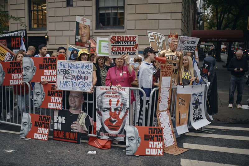 People protest against Prime Minister of Israel Benjamin Netanyahu during the 79th session of the United Nations General Assembly, in New York, on Friday, Sept. 27, 2024. (AP Photo/Andres Kudacki)