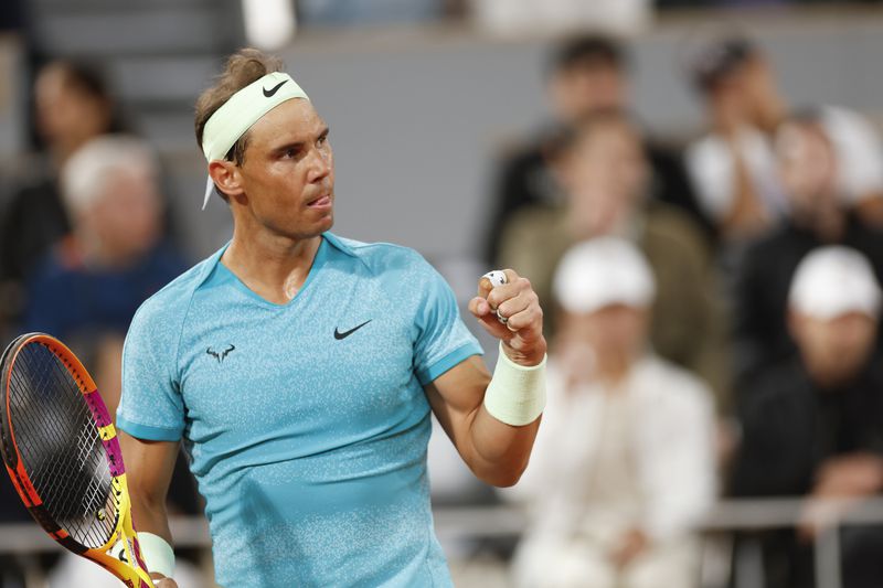 Spain's Rafael Nadal clenches his fist after scoring a point against Germany's Alexander Zverev during their first round match of the French Open tennis tournament at the Roland Garros stadium in Paris, Monday, May 27, 2024. (AP Photo/Jean-Francois Badias)
