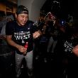 Los Angeles Dodgers designated hitter Shohei Ohtani celebrates with teammates after the Dodgers defeated the San Diego Padres 7-2 in a baseball game to clinch the National League West division Thursday, Sept. 26, 2024, in Los Angeles. (AP Photo/Ashley Landis)