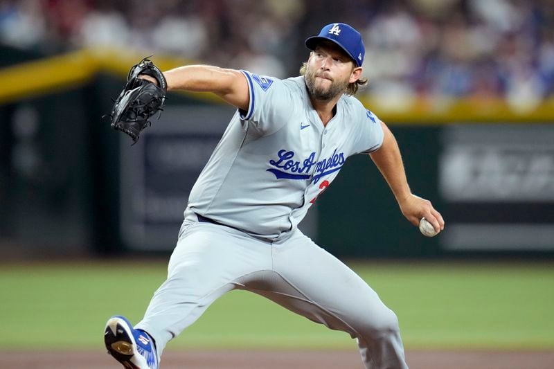 Los Angeles Dodgers pitcher Clayton Kershaw throws against the Arizona Diamondbacks during the first inning of a baseball game Friday, Aug. 30, 2024, in Phoenix. (AP Photo/Ross D. Franklin)