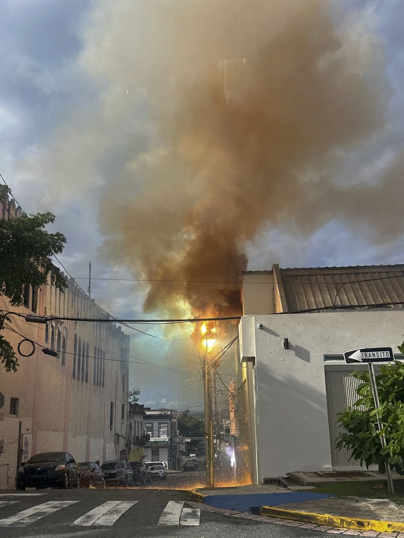 An electrical transformer explodes after the passage of Tropical Storm Ernesto in San Juan, Puerto Rico, Thursday, Aug. 15, 2024. (AP Photo/Alberto Bartolomei)