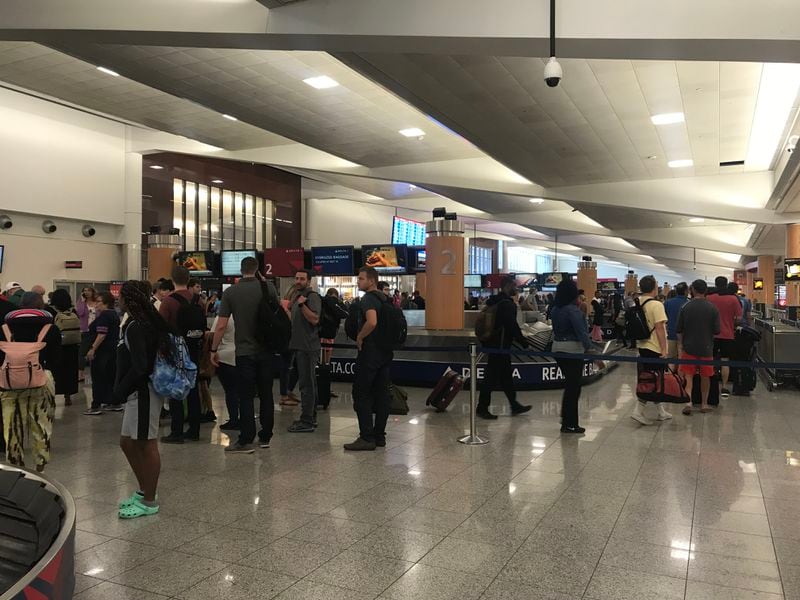 Memorial Day weekend travel is in full swing at Hartsfield-Jackson International Airport on Friday, May 24, 2019. The TSA advises travelers to get to the terminal at least 2 hours and 15 minutes before a domestic flight departure. (Photo: Kelly Yamanouchi/AJC)