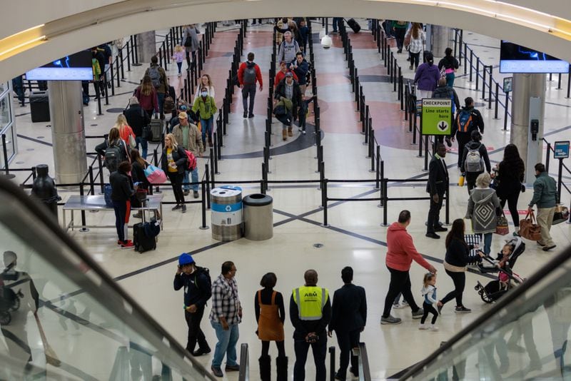 Holiday travelers are seen at Hartsfield-Jackson Atlanta International Airport in Atlanta on Wednesday, November 23, 2022. (Arvin Temkar / arvin.temkar@ajc.com)