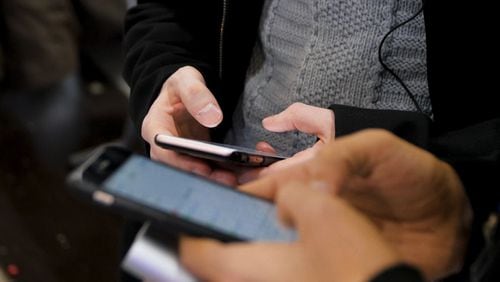 The California State Teachers Retirement System and JANA Partners are urging Apple to help study the effects of smartphone use on children. (Media Whale/Dreamstime/TNS)