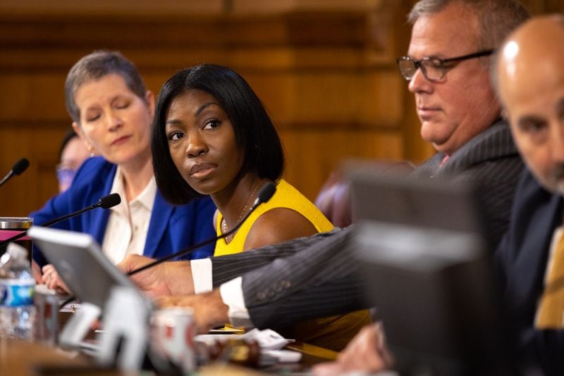 Janelle King (center) joined the State Election Board in May.