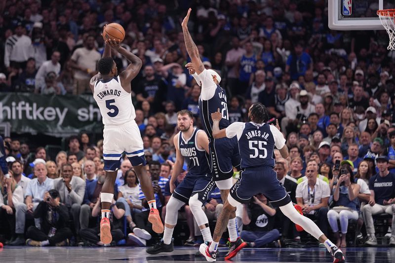 Minnesota Timberwolves guard Anthony Edwards (5) shoots against the Dallas Mavericks during the second half in Game 3 of the NBA basketball Western Conference finals, Sunday, May 26, 2024, in Dallas. (AP Photo/Julio Cortez)