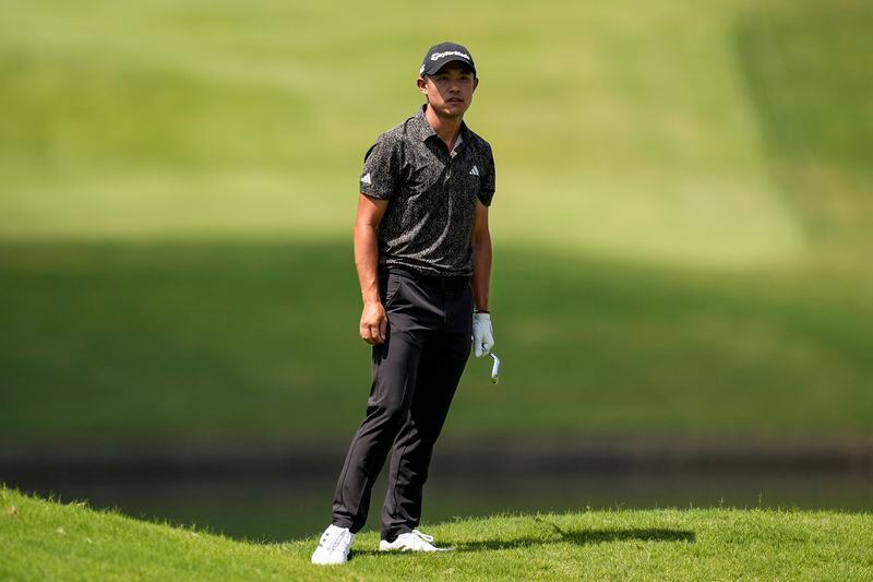 Collin Morikawa views the first hole during the final round of the Tour Championship golf tournament, Sunday, Sept. 1, 2024, in Atlanta. (AP Photo/Mike Stewart)