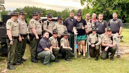 Tift County sheriff's deputy Robert Owens (center) was shot three times during an exchange of gunfire in an Eldorado neighborhood Friday morning.