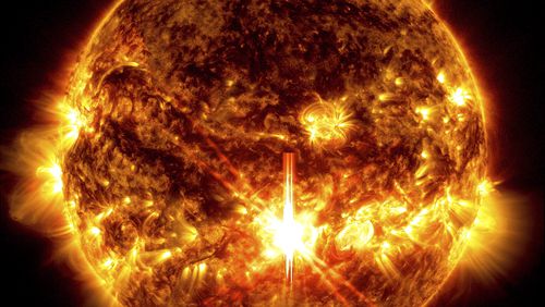 This photo provided by NASA, taken by the Solar Dynamics Observatory, shows a solar flare, the bright flash in the center of the image on Oct. 3, 2024. (Solar Dynamics Observatory/NASA via AP)