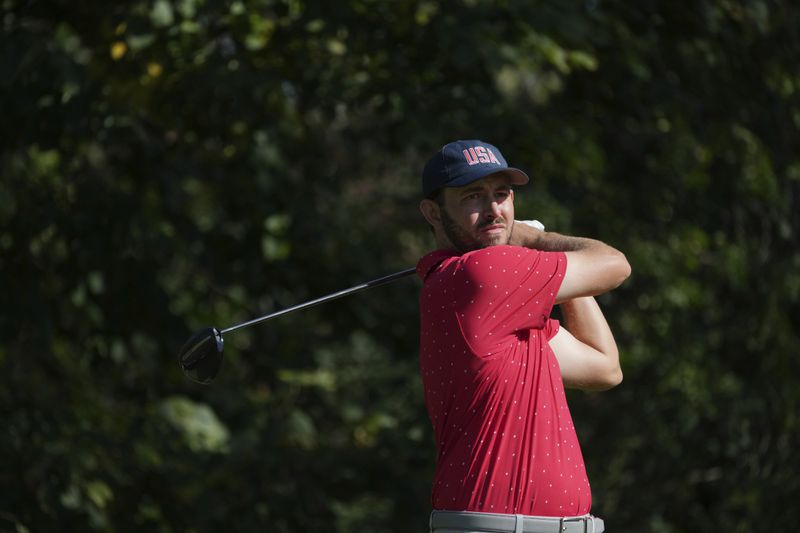 United States team member Patrick Cantlay hits from the fourth tee during a fifth-round singles match at the Presidents Cup golf tournament at Royal Montreal Golf Club, Sunday, Sept. 29, 2024,in Montreal. (Christinne Muschi/The Canadian Press via AP)