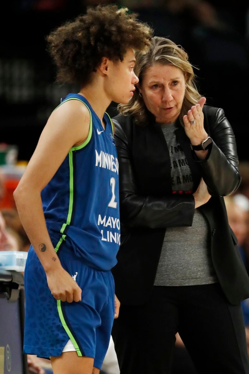 Minnesota Lynx head coach Cheryl Reeve, right, speaks with guard Natisha Hiedeman, left, as they play against the Chicago Sky in the third quarter of a WNBA basketball game Friday, Sept. 13, 2024, in Minneapolis. (AP Photo/Bruce Kluckhohn)