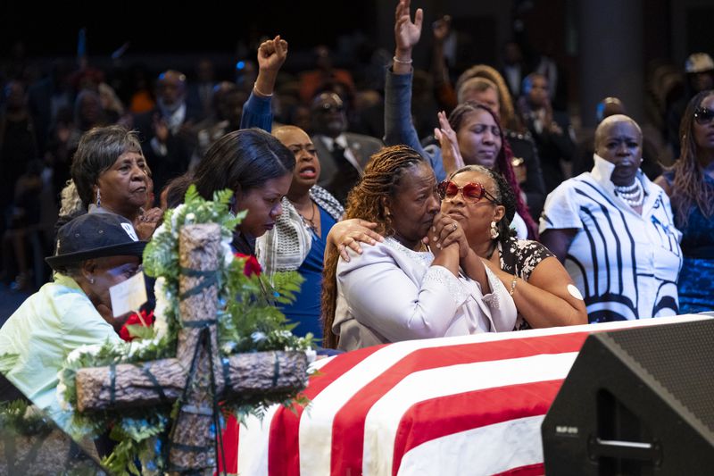 Chantemekki Fortson, center, mother of Senior Airman Roger Fortson, grieves during the funeral for her son at Missionary Baptist Church in Stonecrest on Friday, May 17, 2024.   (Ben Gray / Ben@BenGray.com)