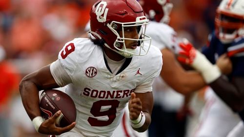 Oklahoma quarterback Michael Hawkins Jr. (9) carries the ball against Auburn during the first half of an NCAA college football game, Saturday, Sept. 28, 2024, in Auburn, Ala. (AP Photo/Butch Dill)