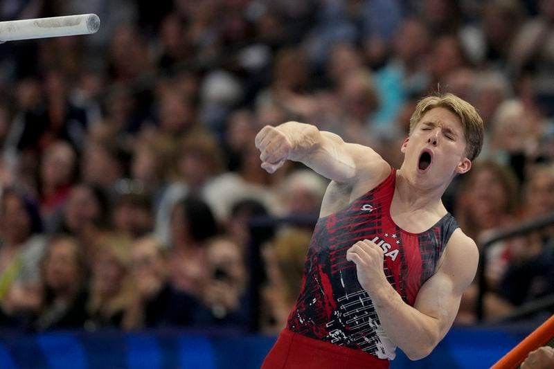 Shane Wiskus competes on the parallel bars at the United States Gymnastics Olympic Trials on Saturday, June 29, 2024, in Minneapolis. (AP Photo/Charlie Riedel)
