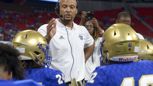 Former McEachern head coach Franklin Stephens talks to his players during a time out late in the first half of their game at the Mercedes Benz Stadium in Atlanta during the Corky Kell Classic Saturday, August 24, 2019. PHOTO/Daniel Varnado