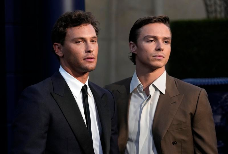 Cooper Koch, left, and Nicholas Alexander Chavez, cast members in "Monsters: The Lyle and Erik Menendez Story," pose together at the premiere of the Netflix series at the Egyptian Theatre, Monday, Sept. 16, 2024, in Los Angeles. (AP Photo/Chris Pizzello)