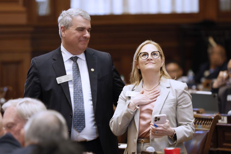 Esther Panitch D-Sandy Springs, and John Carson, R-Marietta, celebrate the passage of the House Bill 30 in the Georgia House on Crossover Day at the Capitol in Atlanta on Monday, March 5, 2023. (Miguel Martinez/The Atlanta Journal-Constitution)