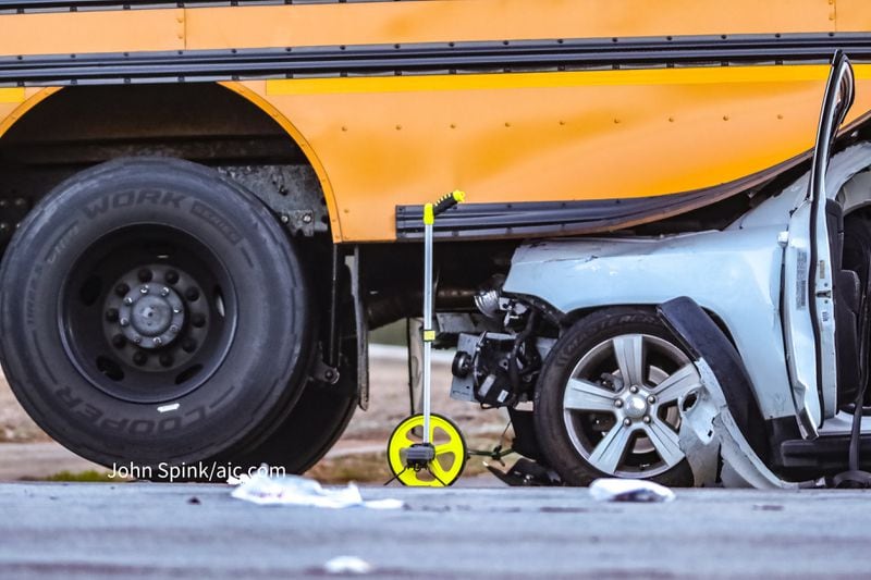 The SUV crashed into the back of a DeKalb County school bus near Redan early Thursday morning. 
