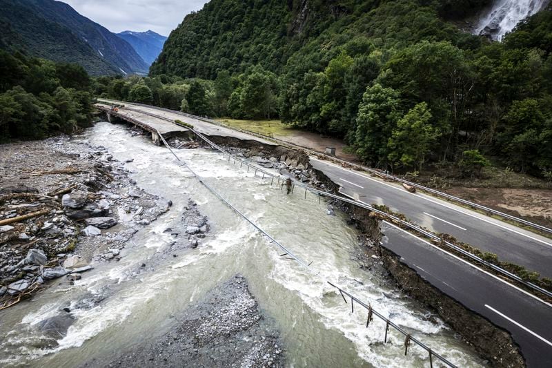 The highway A13 between Lostallo and Soazza is seen destroyed by the force of the Moesa river, caused by heavy rain in the Misox valley, in Lostallo, southern Switzerland, Sunday, June 23, 2024. Massive thunderstorms and rainfall led to a flooding situation on Friday evening after a landslide in the Misox valley. Four people went missing on Saturday morning. Several dozen people had to be evacuated from their homes in the Misox and Calanca regions. (Michael Buholzer/Keystone via AP)