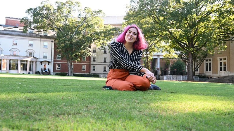 University of Georgia first year student Yara Manasrah sits on the grass near Reed Hall one of her favorite spots on the campus in Athens on Friday, October 16, 2020. (Hyosub Shin / Hyosub.Shin@ajc.com)