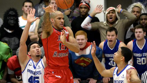 South Alabama forward Mychal Ammons (13) is double teamed by Georgia State's Denny Burguillos (45) and Manny Atkins, right, in the first half of their NCAA college basketball game at the GSU Arena on Monday, Feb. 3, 2014, in Atlanta. Georgia State is looking to extend its school-record winning streak to 13 games. David Tulis / AJC Special