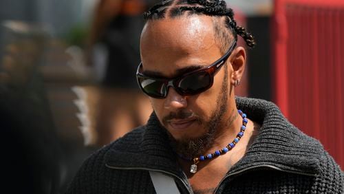 Mercedes driver Lewis Hamilton of Britain walks in the paddock at the Baku circuit, in Baku, Azerbaijan, Thursday, Sept.12, 2024. The Formula One Grand Prix will be held on Sunday. (AP Photo/Sergei Grits)