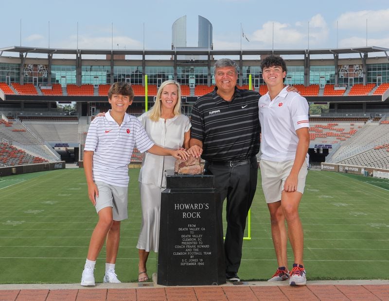 Matt Luke and his family pose next to 'Howard's Rock' at Clemson's Memorial Stadium this past spring. They are (L-R) Cooper, 13, wife Ashley, and 16-year-old Harrison, a sophomore safety at North Oconee High School. (Photo courtesy of Clemson Athletics)