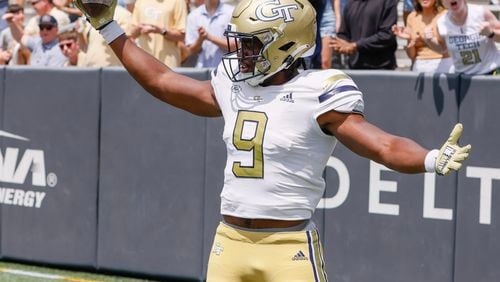 Avery Boyd celebrates his TD reception for Team Swarm during Georgia Tech's spring football game in Atlanta on Saturday, April 15, 2023.   (Bob Andres for The Atlanta Journal-Constitution)