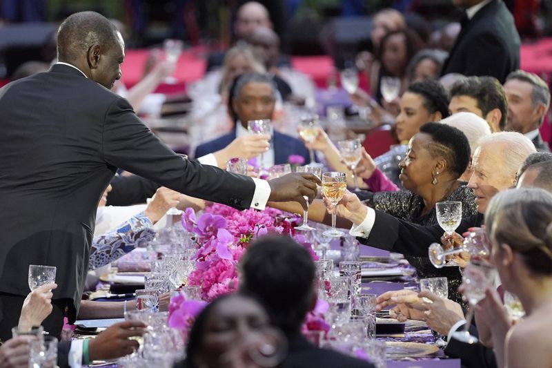 Kenya's President William Ruto exchanges a toast with President Joe Biden during a State Dinner at the White House, Thursday, May 23, 2024, in Washington. (AP Photo/Evan Vucci)