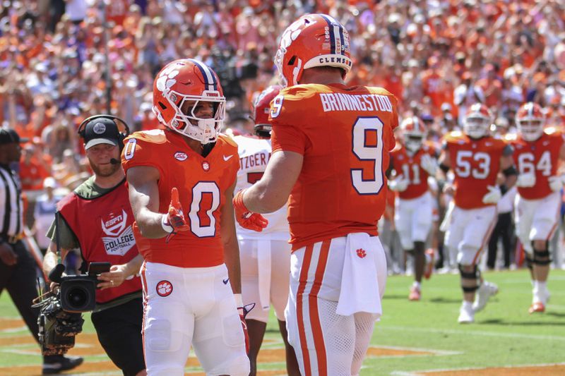 Clemson wide receiver Antonio Williams (0) celebrates a 2-yard touchdown reception with tight end Jake Briningstool (9) during the first half of an NCAA college football game against North Carolina State Saturday, Sept. 21, 2024, in Clemson, S.C. (AP Photo/Artie Walker Jr.)