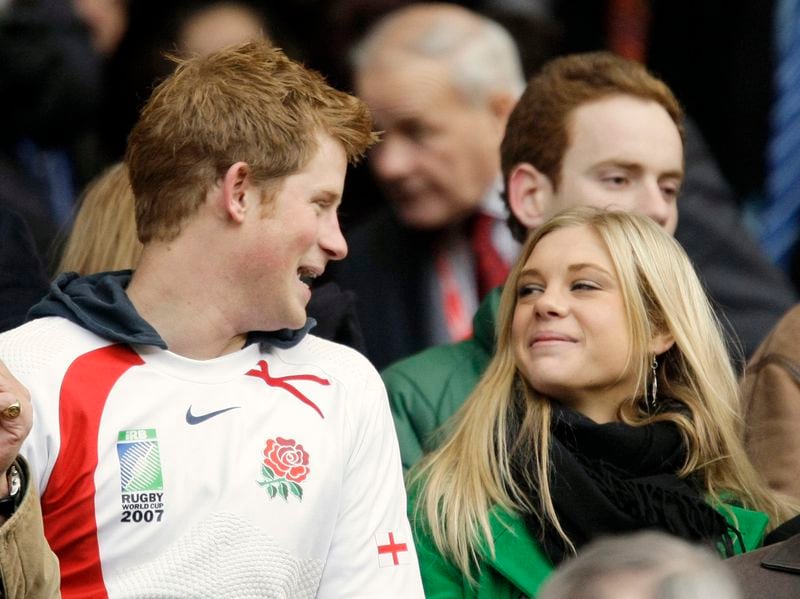 FILE - Britain's Prince Harry, left, talks to his girlfriend Chelsy Davy, who was born in Zimbabwe, before the international rugby match between England and South Africa at Twickenham stadium in west London, Saturday, Nov. 22, 2008. (AP Photo/Matt Dunham, File)