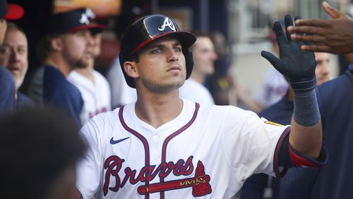 Atlanta Braves third baseman Austin Riley celebrates with teammates in the dugout after hitting a solo home run during the second inning against the San Francisco Giants at Truist Park, Tuesday, July 2, 2024, in Atlanta. (Jason Getz / AJC)
