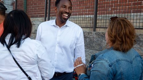 Andre Dickens talks with supporters before formally announcing his bid for mayor at Monday Night Garage in Atlanta on May 20, 2021. STEVE SCHAEFER FOR THE ATLANTA JOURNAL-CONSTITUTION