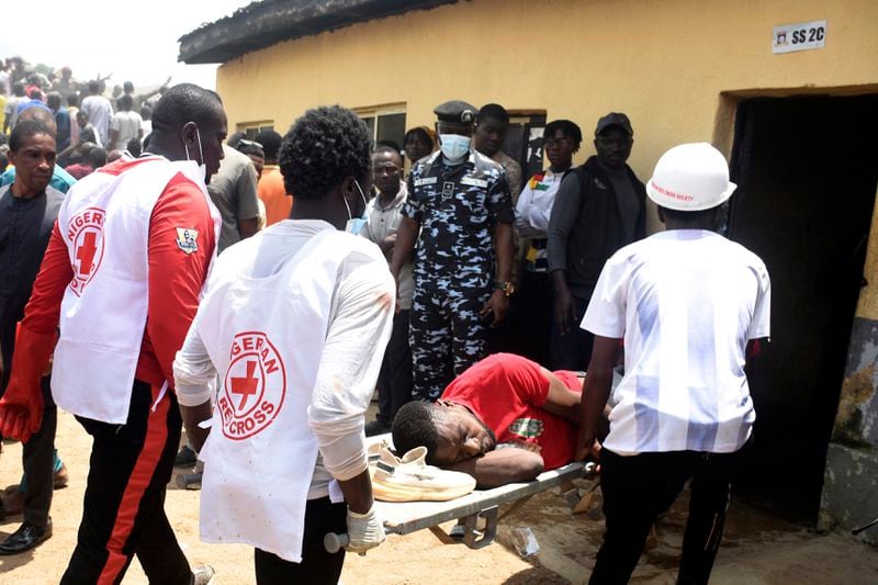 A man is rescued from the rubble of a collapsed two-storey building in Jos, Nigeria, Friday, July, 12, 2024. At least 12 students have been killed after a school building collapsed and trapped them in northern Nigeria, authorities said on Friday. (AP Photos)