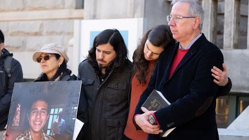 230313-Decatur-Manuel ÒTortuguitaÓ TeranÕs mother Belkis Teran, from left, brother Daniel Paez, brother Pedro Santema and father Joel Paez listen to their attorney speak during a press conference Monday, March 13, 2023, in Decatur to release the results of an autopsy they commissioned. Ben Gray for the Atlanta Journal-Constitution