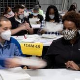 201116-Lawrenceville-Workers count ballots at the Gwinnett County election warehouse in Lawrenceville on Monday evening, Nov. 16, 2020. Ben Gray for the Atlanta Journal-Constitution