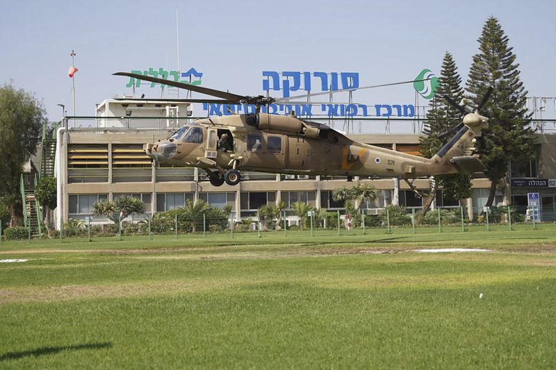 In this photo released by Israeli Defense Forces on Tuesday, Aug. 27, 2024, a military helicopter carrying Qaid Farhan Alkadi lands at the Soroka Medical Center in Beersheba, Israel. The military said on Tuesday that 52-year-old Qaid Farhan Alkadi was rescued "in a complex operation in the southern Gaza Strip." (Israeli Defense Forces via AP)