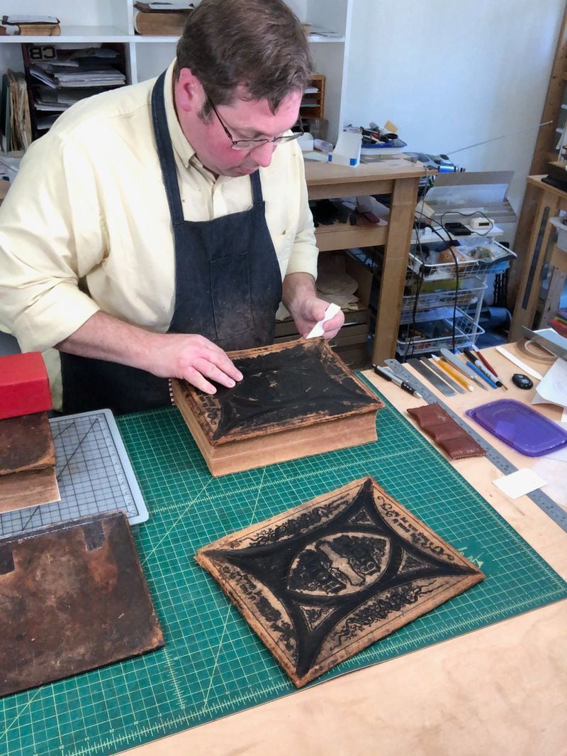 Andrew Huot, owner of Big River Bindery, frequently restores old, treasured family Bibles. Courtesy of Andrew Huot