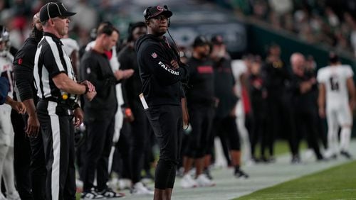 Atlanta Falcons head coach Raheem Morris watches action during the first half of an NFL football game against the Philadelphia Eagles on Monday, Sept. 16, 2024, in Philadelphia. (AP Photo/Matt Rourke)