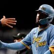 Milwaukee Brewers' Jackson Chourio is congratulated after hitting an RBI single during the fourth inning of a baseball game against the New York Mets, Friday, Sept. 27, 2024, in Milwaukee. (AP Photo/Aaron Gash)