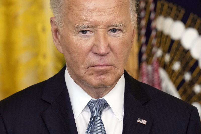 President Joe Biden listens during a Medal of Honor ceremony at the White House in Washington, Wednesday, July 3, 2024, posthumously honoring two U.S. Army privates who were part of a daring Union Army contingent that stole a Confederate train during the Civil War. U.S. Army Pvts. Philip G. Shadrach and George D. Wilson were captured by Confederates and executed by hanging. (AP Photo/Susan Wals