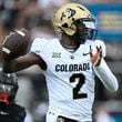 Colorado quarterback Shedeur Sanders (2) throws a pass as Central Florida defensive back Braeden Marshall (4) defends during the first half of an NCAA college football game, Saturday, Sept. 28, 2024, in Orlando, Fla. (AP Photo/Phelan M. Ebenhack)