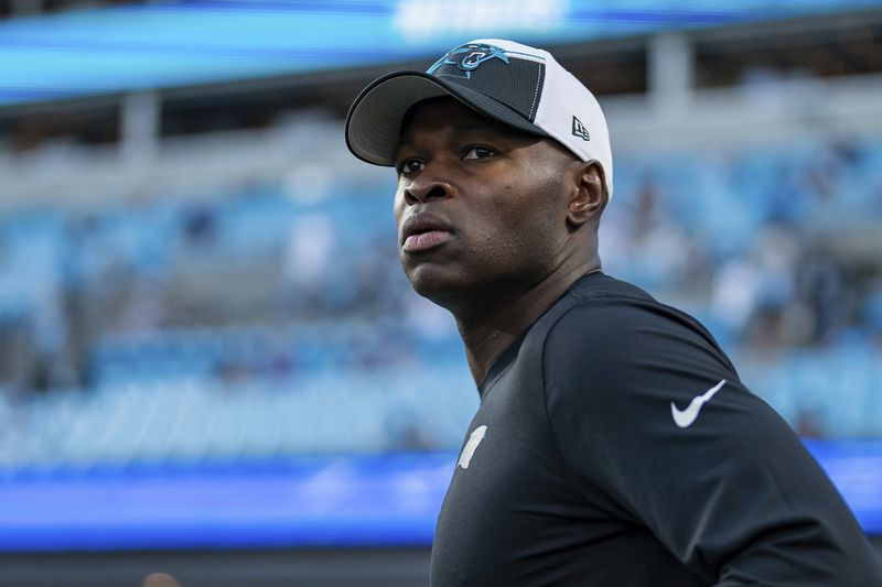 Carolina Panthers defensive coordinator Ejiro Evero looks on before an NFL football game against the New Orleans Saints Monday, Sept. 18, 2023, in Charlotte, N.C. (AP Photo/Jacob Kupferman)