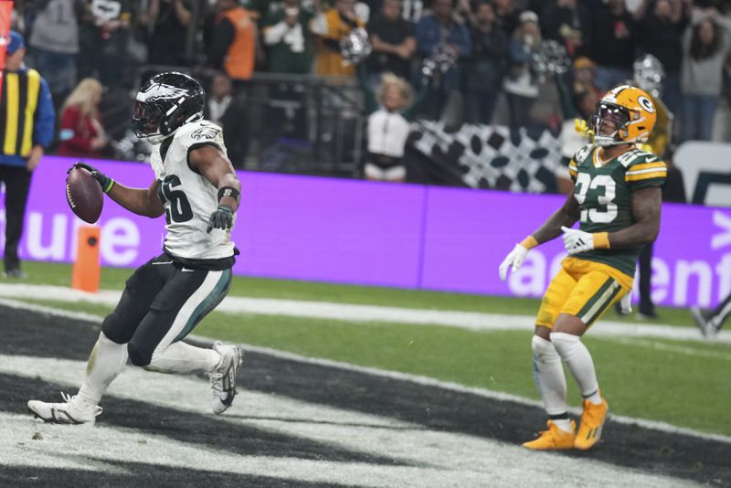 Philadelphia Eagles running back Saquon Barkley (26) celebrates after scoring against the Green Bay Packers during the first half of an NFL football game, Friday, Sept. 6, 2024, at the Neo Quimica Arena in Sao Paulo. (AP Photo/Fernando Llano)