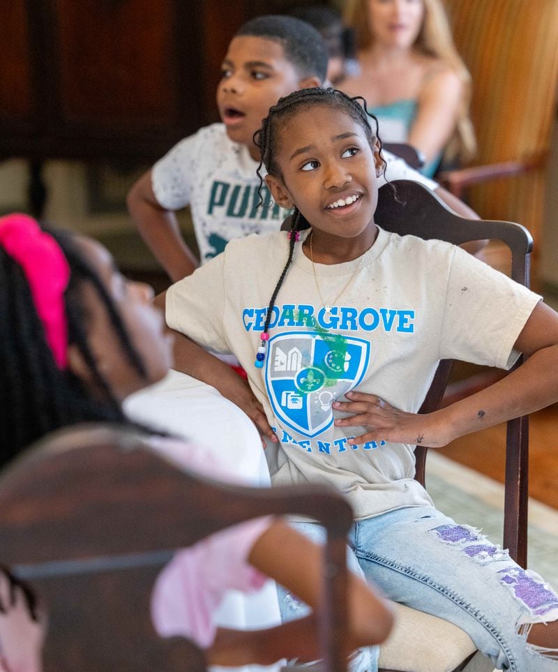 Karter Montgomery feels her diaphragm as she sings while jazz musician Karla Harris teaches kids at a summer camp at Callanwolde Fine Arts Center. PHIL SKINNER FOR THE ATLANTA JOURNAL-CONSTITUTION